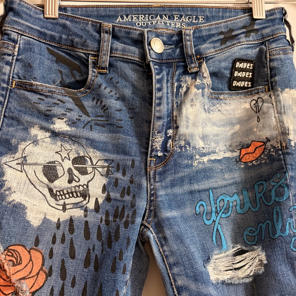 Distressed Blue Graphic Women’s Jeans with Patch & Embroidery - Picture 3 of 10